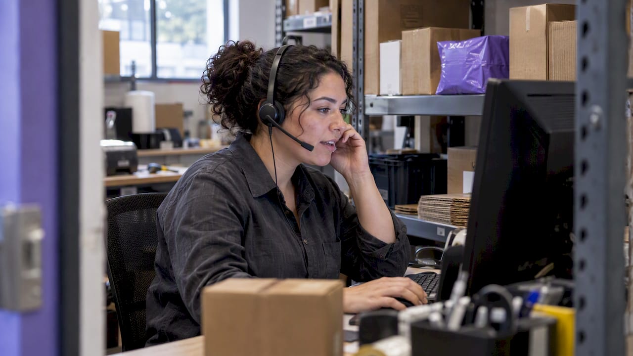 Support agent checks shipment data during a call