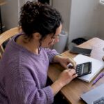 Shop owner calculating customer support payback