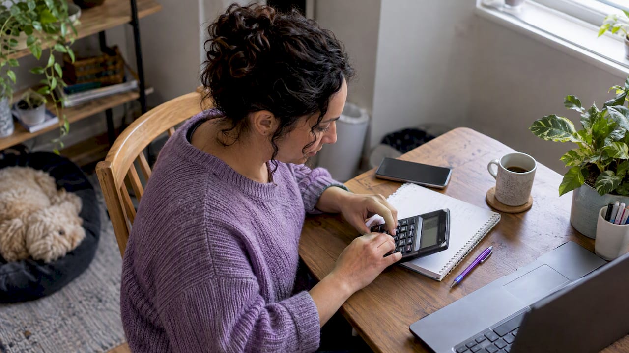 Shop owner calculating customer support payback